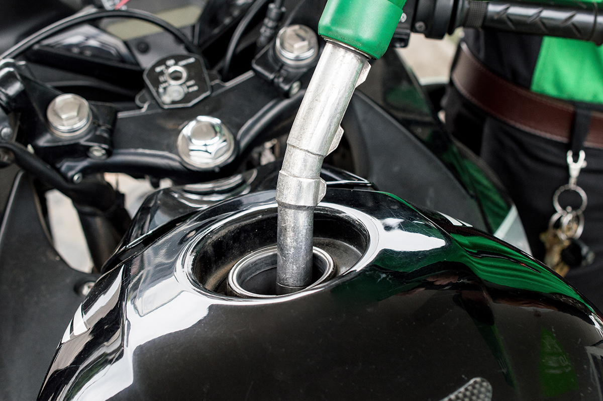 picture of a motorbike adding fuel