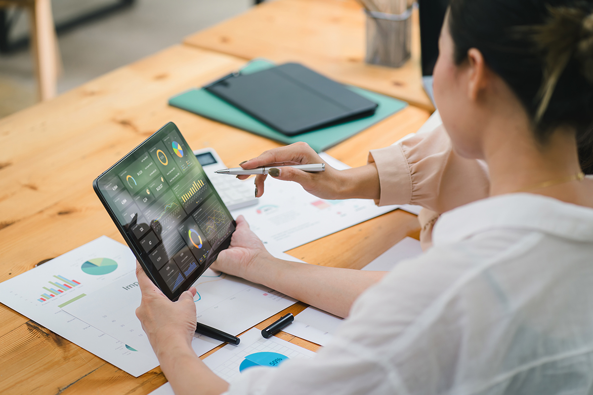 Picture of a person analyzing a report