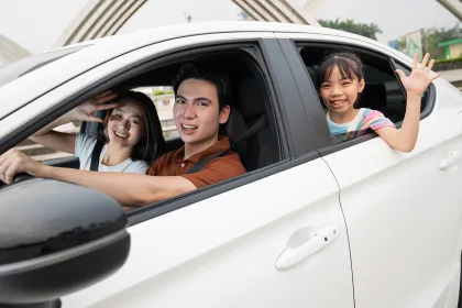 Picture of a family traveling in a car